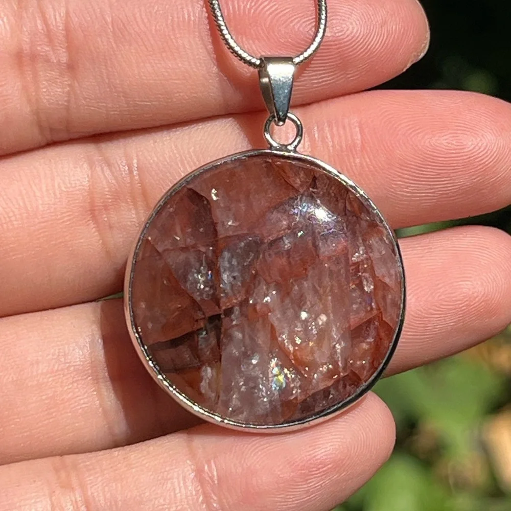 Silver‎ plated round fire Quartz pendant